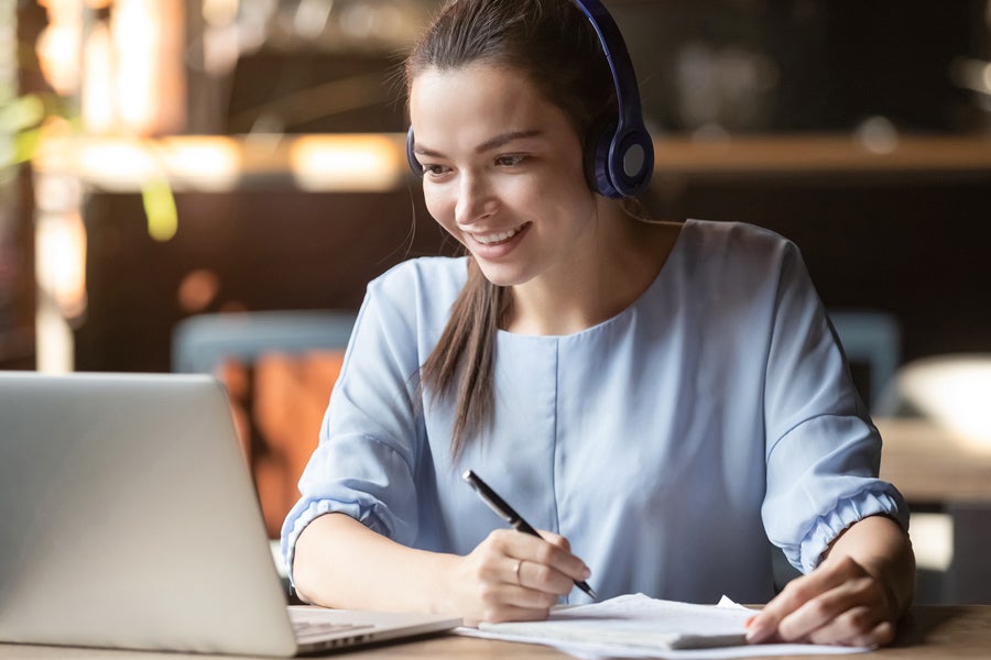 Student looking at her laptop doing homework